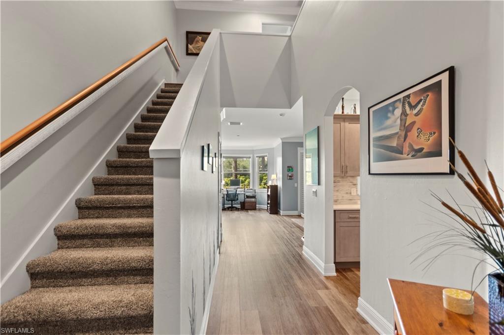 9801 Foxhall Way, Unit 5 Estero, FL 33928 - Photo 4 of 26 a view of entryway with furniture and wooden floor