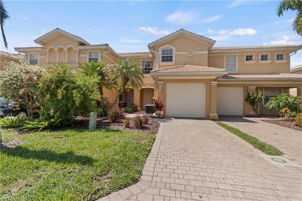 9801 Foxhall Way, Unit 5 Estero, FL 33928 - Photo 6 of 26 a view of a front of a house with a yard