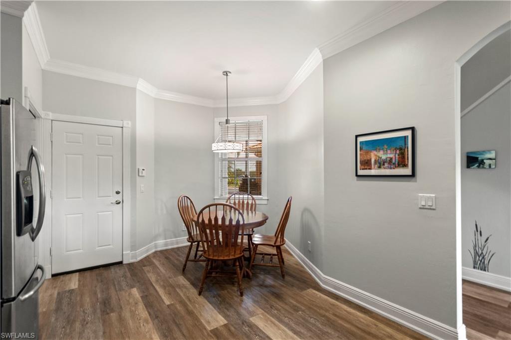 9801 Foxhall Way, Unit 5 Estero, FL 33928 - Photo 8 of 26 a view of a room with furniture wooden floor and window