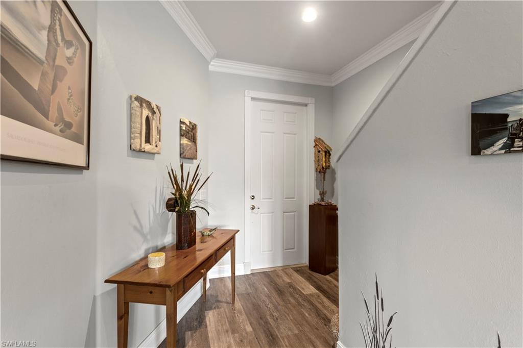 9801 Foxhall Way, Unit 5 Estero, FL 33928 - Photo 10 of 26 a view of entryway with wooden floor