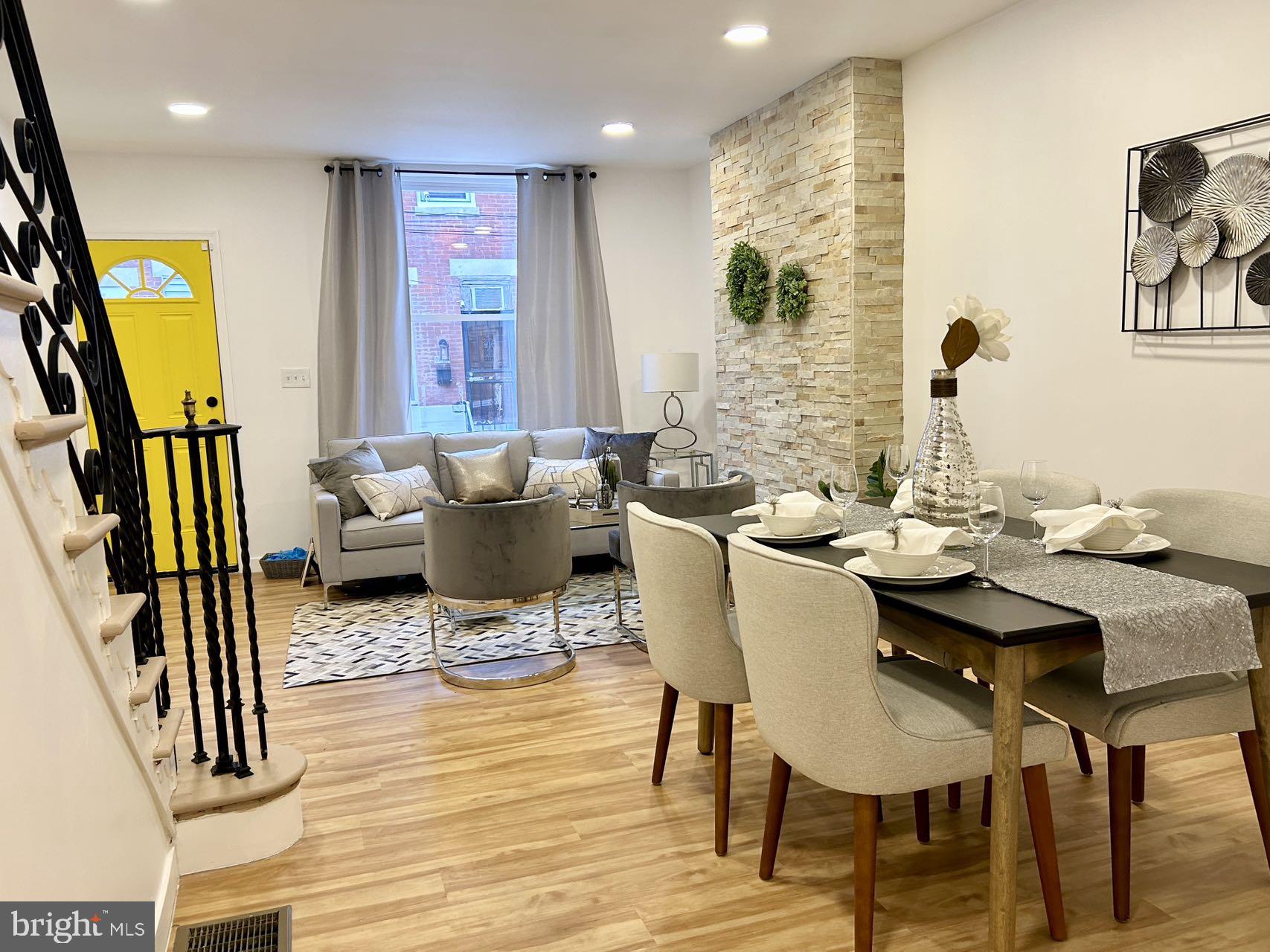 2013 South Bouvier Street Philadelphia, PA 19145 - Photo 4 of 18 a view of a dining room with furniture and wooden floor