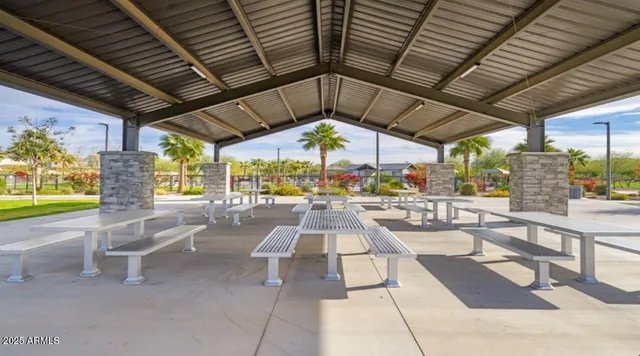 a view of a swimming pool with a patio and a garden