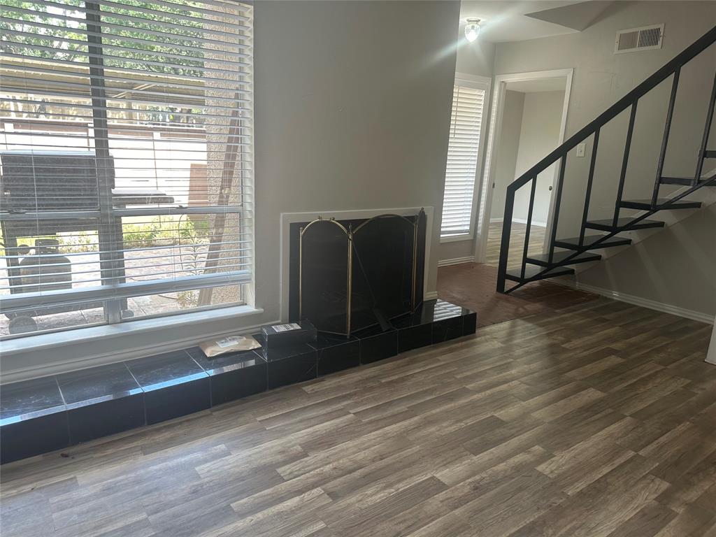 3121 Park Lane, Unit 1147 Dallas, TX 75220 - Photo 6 of 22 a living room with wooden floor and a window