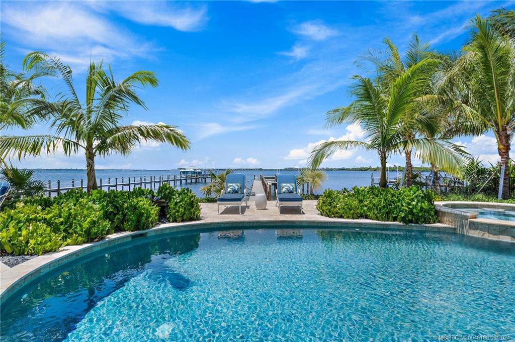 4110 Northeast Joes Point Road Stuart, FL 34996 - Photo 14 of 67 a house view with a garden space