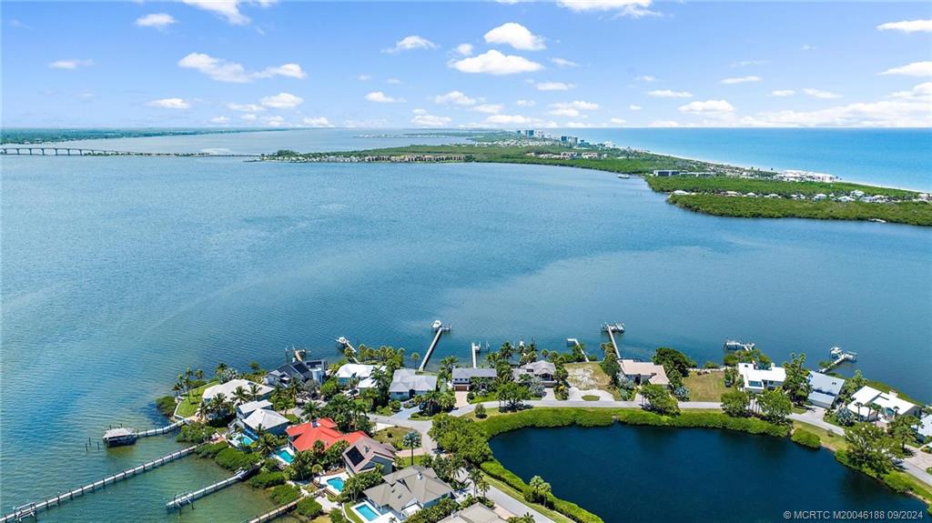 4110 Northeast Joes Point Road Stuart, FL 34996 - Photo 17 of 67 a view of a lake with houses in the back