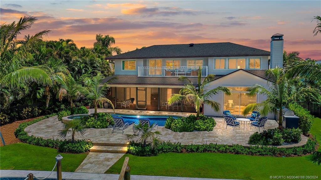 4110 Northeast Joes Point Road Stuart, FL 34996 - Photo 23 of 67 a front view of a house with a yard