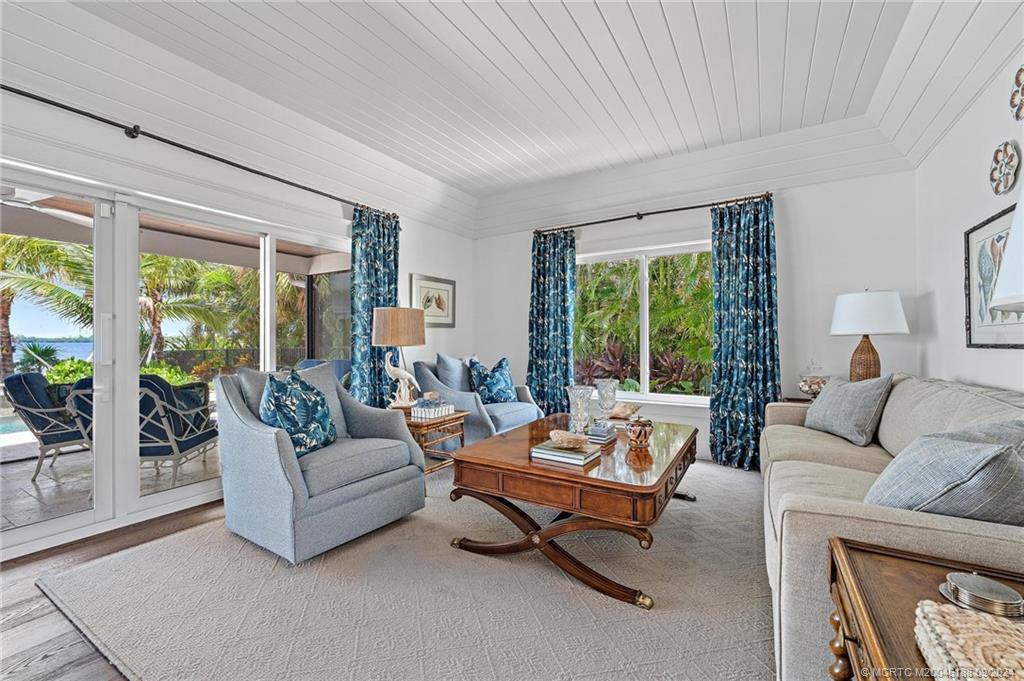 4110 Northeast Joes Point Road Stuart, FL 34996 - Photo 27 of 67 a living room with furniture and a large window