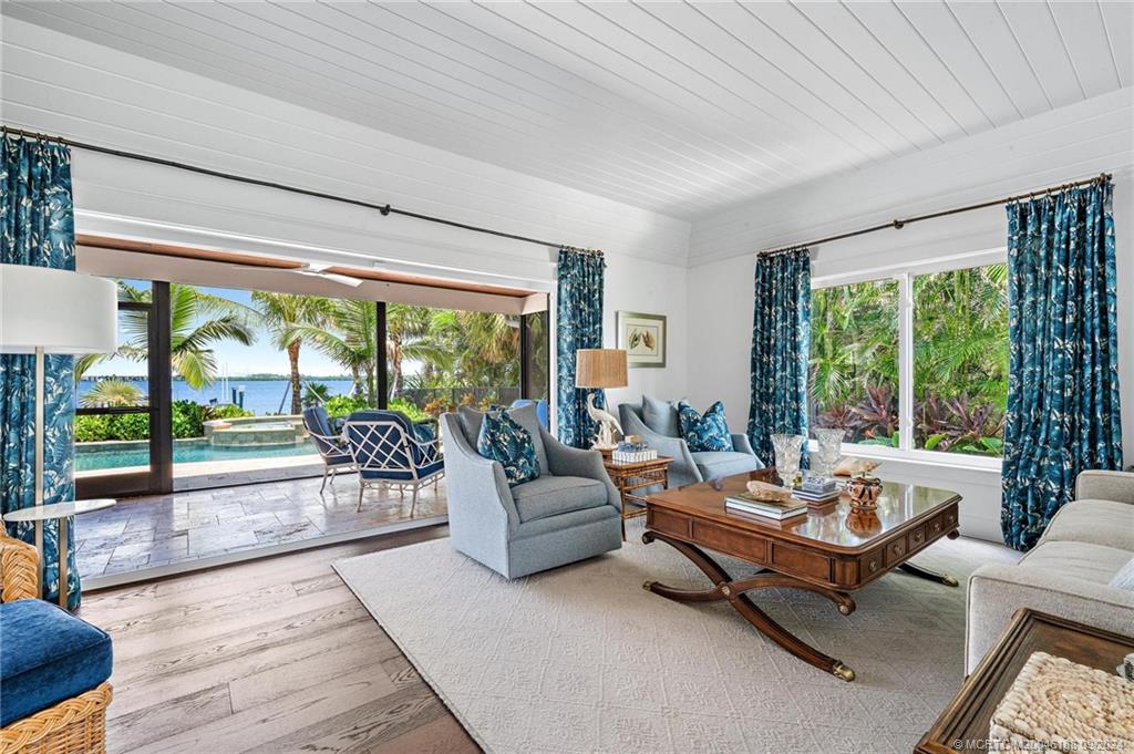 4110 Northeast Joes Point Road Stuart, FL 34996 - Photo 29 of 67 a living room with furniture and a large window