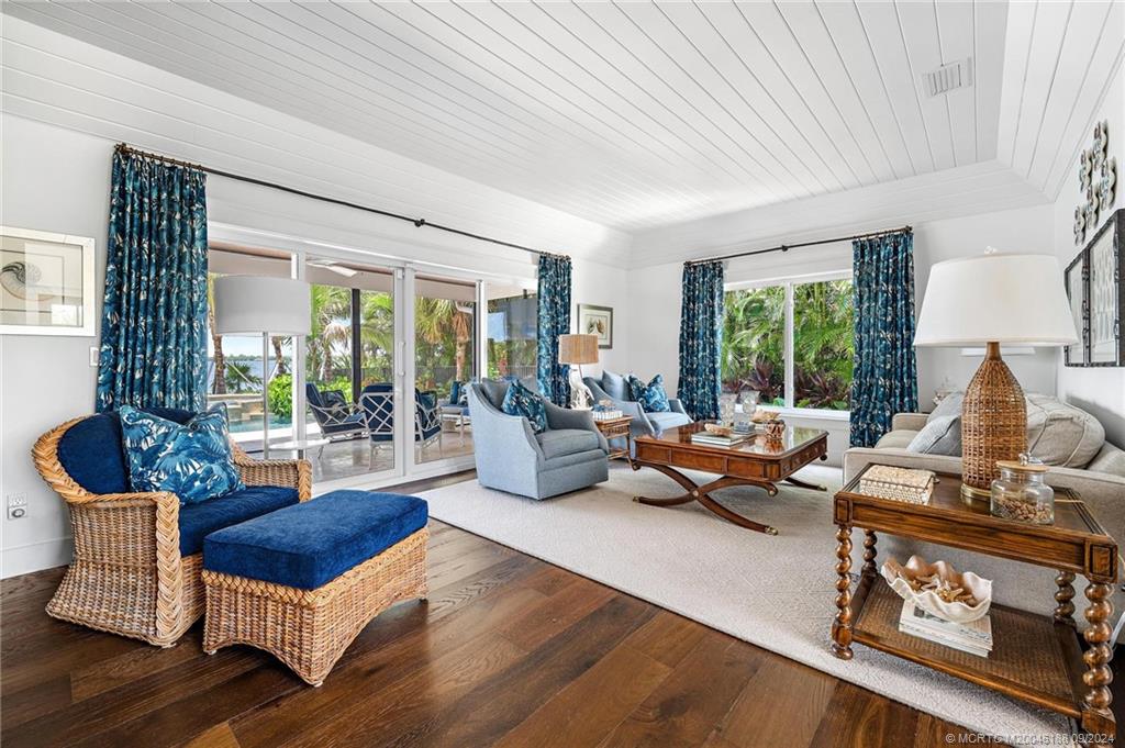 4110 Northeast Joes Point Road Stuart, FL 34996 - Photo 31 of 67 a living room with furniture and a large window