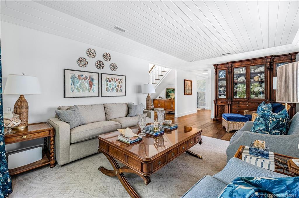 4110 Northeast Joes Point Road Stuart, FL 34996 - Photo 32 of 67 a living room with furniture and a large window