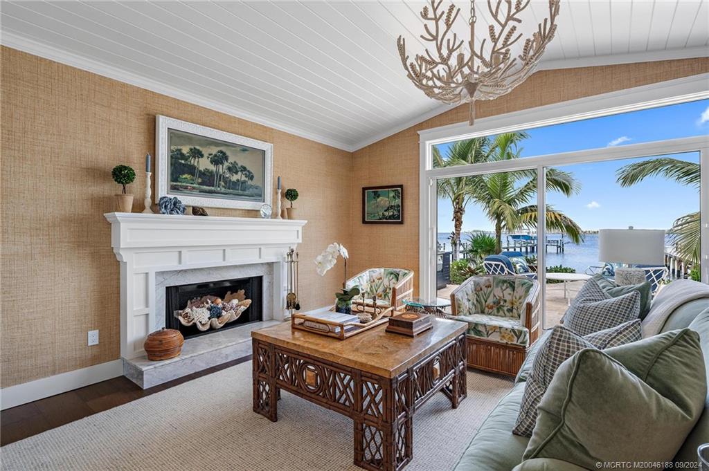 4110 Northeast Joes Point Road Stuart, FL 34996 - Photo 34 of 67 a living room with furniture and a fireplace