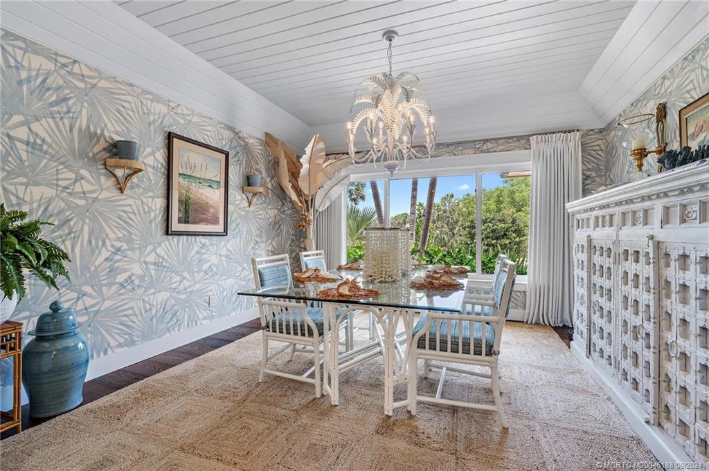 4110 Northeast Joes Point Road Stuart, FL 34996 - Photo 36 of 67 a view of a dining room with furniture a chandelier and window