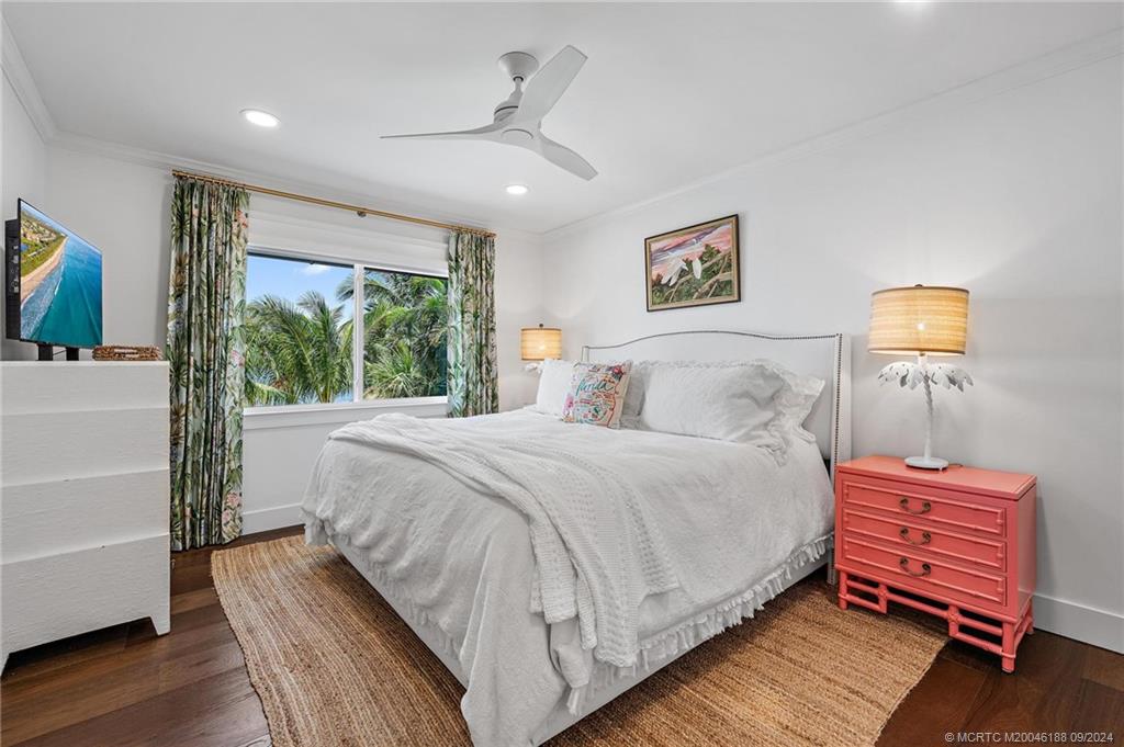 4110 Northeast Joes Point Road Stuart, FL 34996 - Photo 46 of 67 a bedroom with a bed and a window