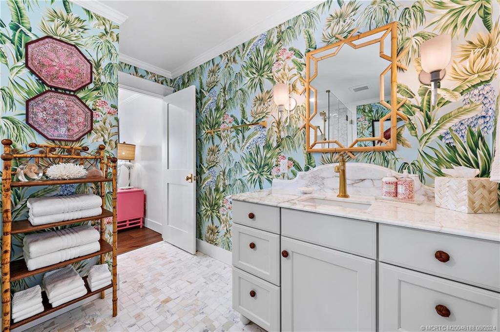 4110 Northeast Joes Point Road Stuart, FL 34996 - Photo 48 of 67 a bathroom with a sink and mirror