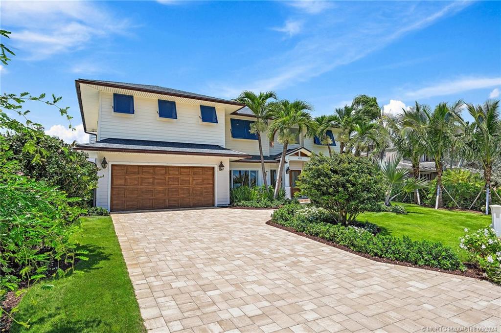 4110 Northeast Joes Point Road Stuart, FL 34996 - Photo 5 of 67 a front view of a house with a yard