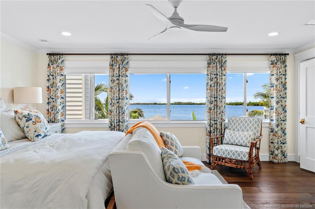 4110 Northeast Joes Point Road Stuart, FL 34996 - Photo 52 of 67 a bedroom with a bed and a couch