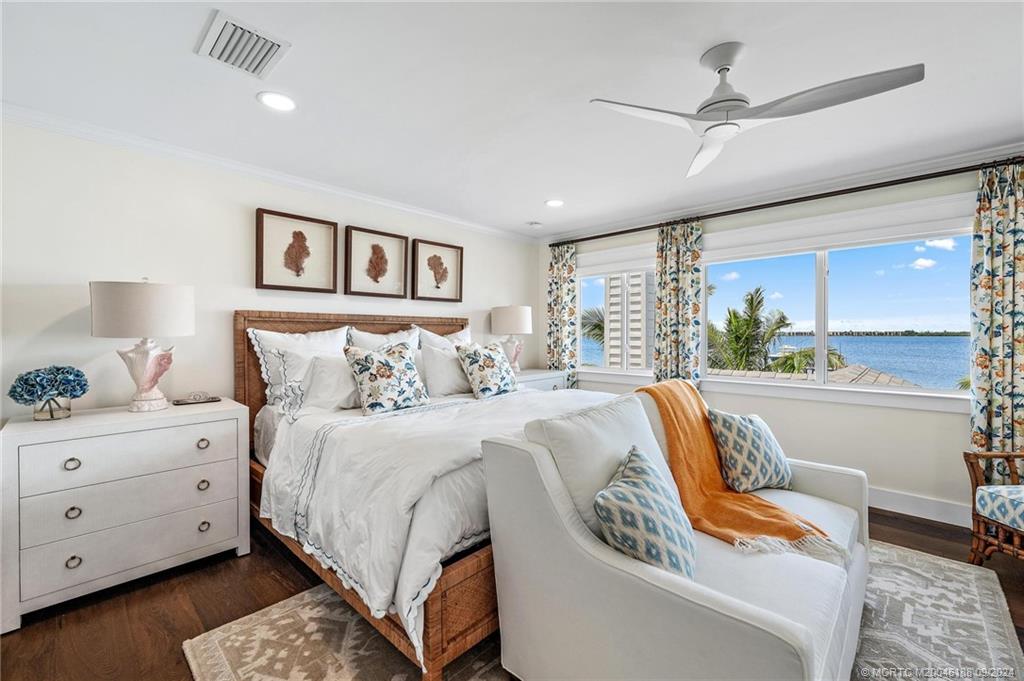 4110 Northeast Joes Point Road Stuart, FL 34996 - Photo 58 of 67 a bedroom with a bed and a window