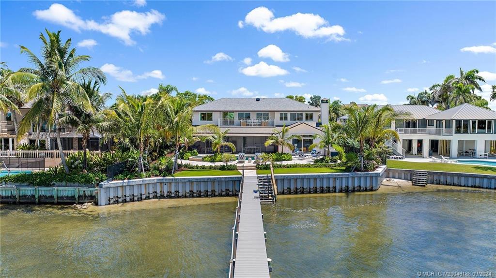 4110 Northeast Joes Point Road Stuart, FL 34996 - Photo 60 of 67 a view of house with swimming pool and outdoor seating