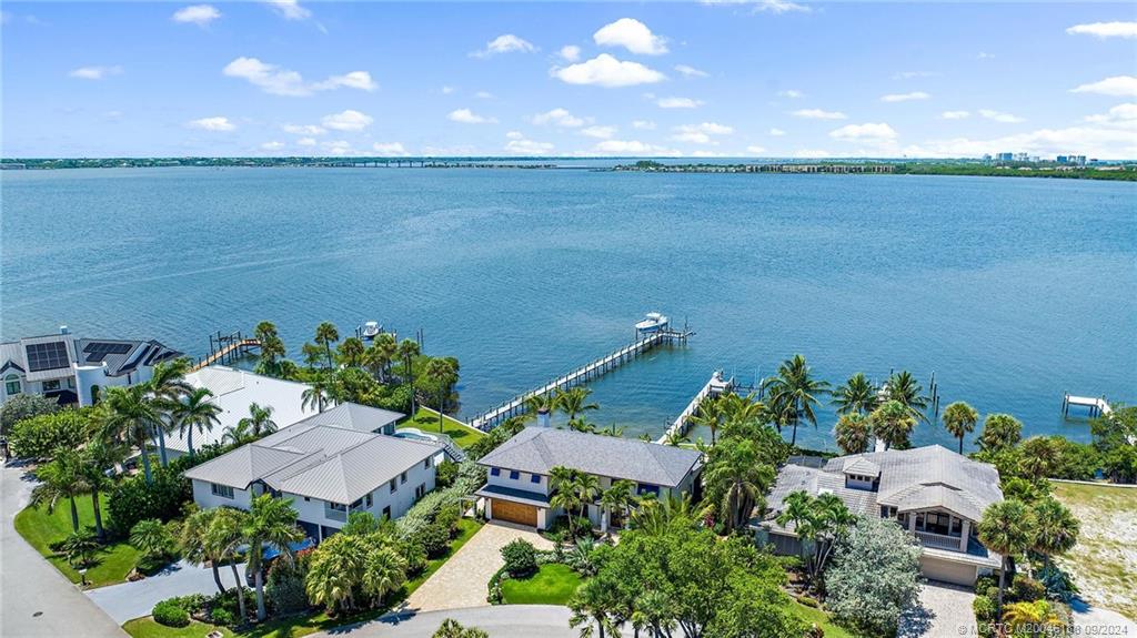 4110 Northeast Joes Point Road Stuart, FL 34996 - Photo 64 of 67 an aerial view of a house with a lake view