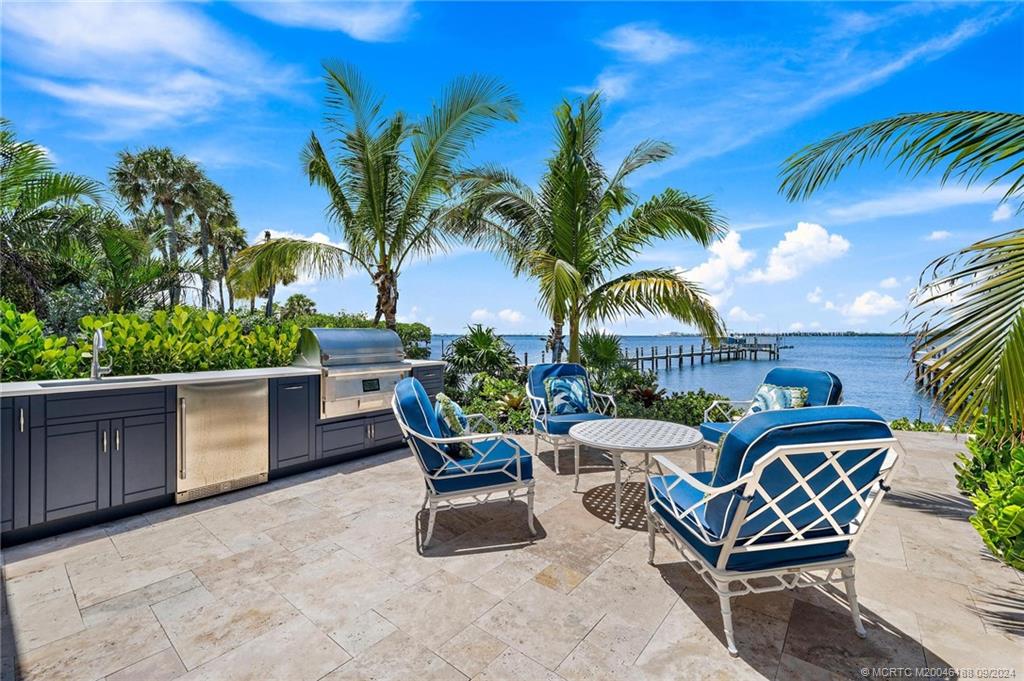 4110 Northeast Joes Point Road Stuart, FL 34996 - Photo 67 of 67 a view of a chairs and table in patio