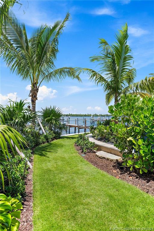 4110 Northeast Joes Point Road Stuart, FL 34996 - Photo 8 of 67 a view of a yard with a palm tree