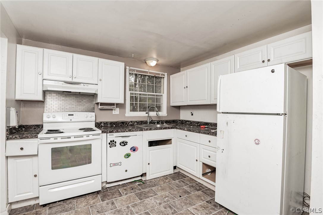 9333 Carbe Road North Chesterfield, VA 23236 - Photo 13 of 34 a kitchen with granite countertop white cabinets and white appliances