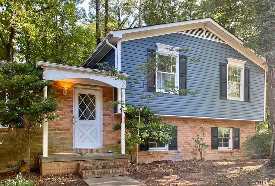 9333 Carbe Road North Chesterfield, VA 23236 - Photo 2 of 34 a front view of a house with garden