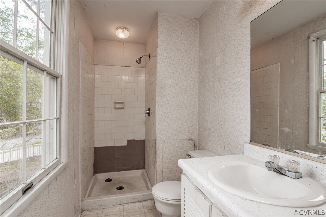 9333 Carbe Road North Chesterfield, VA 23236 - Photo 21 of 34 a bathroom with a sink a toilet and shower