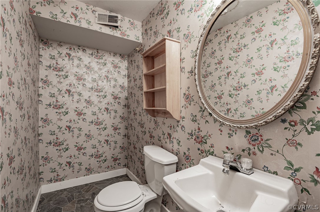 9333 Carbe Road North Chesterfield, VA 23236 - Photo 26 of 34 a bathroom with a toilet and a sink