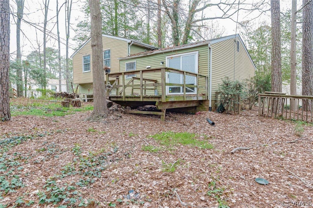 9333 Carbe Road North Chesterfield, VA 23236 - Photo 28 of 34 a backyard of a house with barbeque oven and outdoor seating