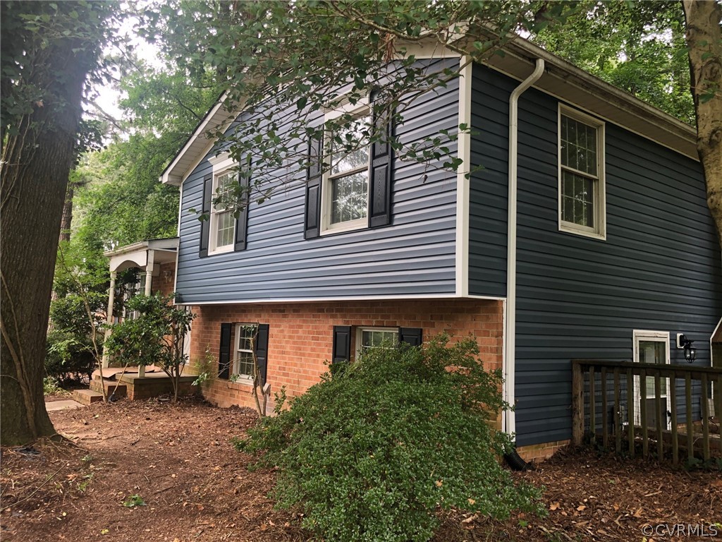 9333 Carbe Road North Chesterfield, VA 23236 - Photo 3 of 34 a front view of a house with plants