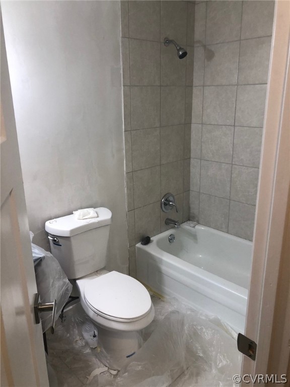 9333 Carbe Road North Chesterfield, VA 23236 - Photo 32 of 34 a white toilet and tub sitting next to a bathroom sink