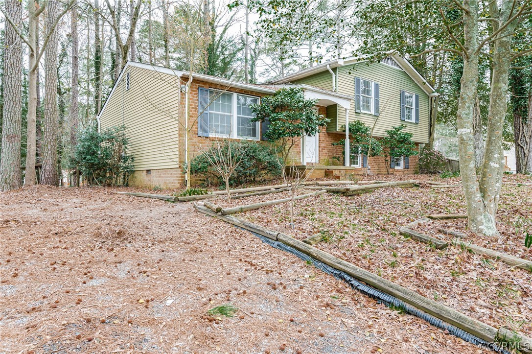 9333 Carbe Road North Chesterfield, VA 23236 - Photo 6 of 34 a view of a house with a yard and sitting area