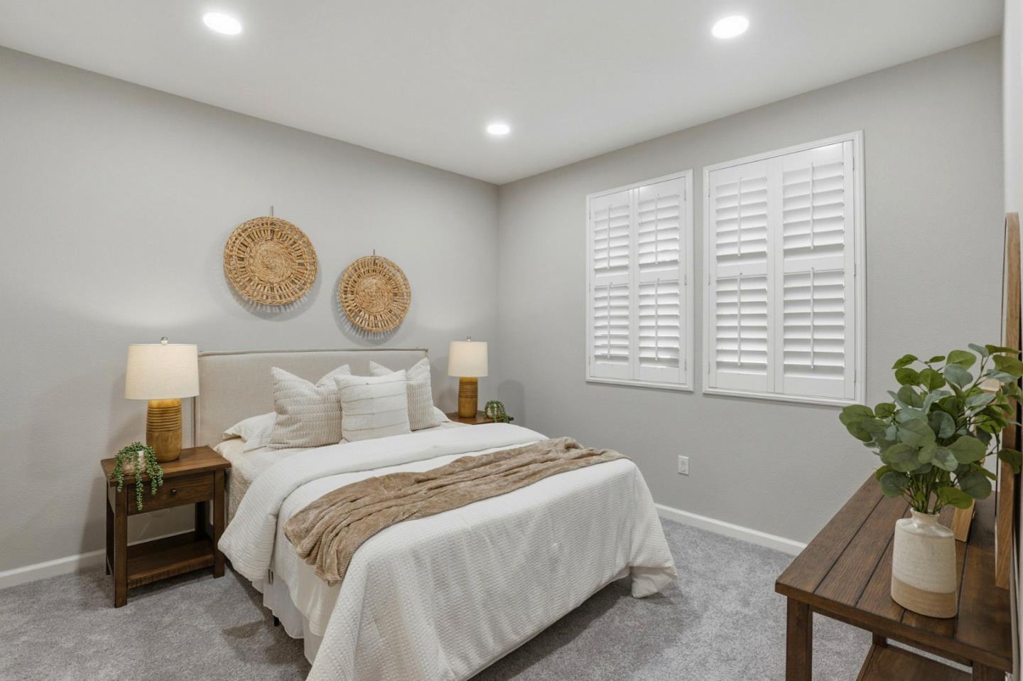 172 East Main Avenue Morgan Hill, CA 95037 - Photo 25 of 36 a bedroom with a bed and a potted plant