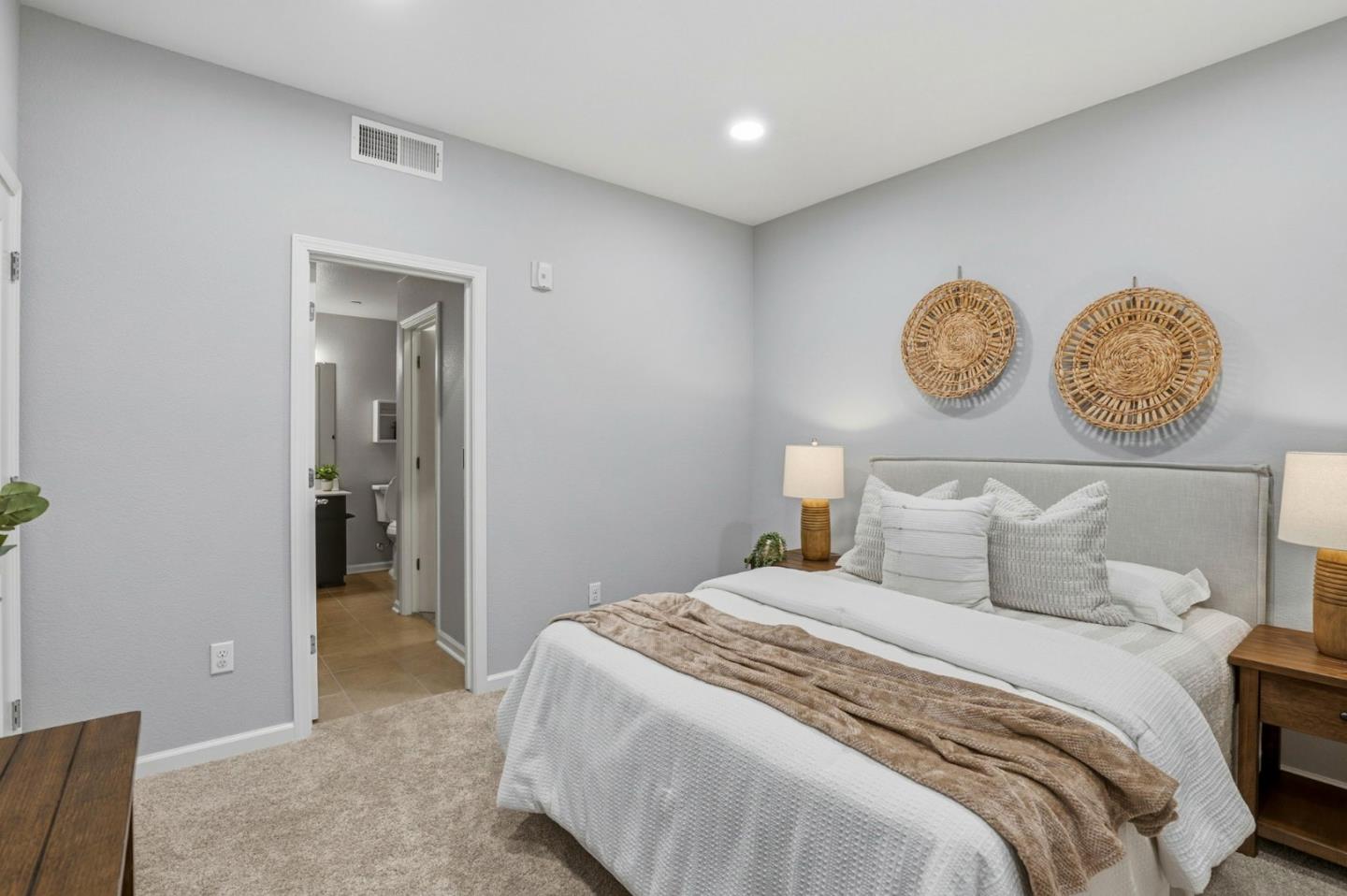 172 East Main Avenue Morgan Hill, CA 95037 - Photo 26 of 36 a bedroom with a bed and a clock