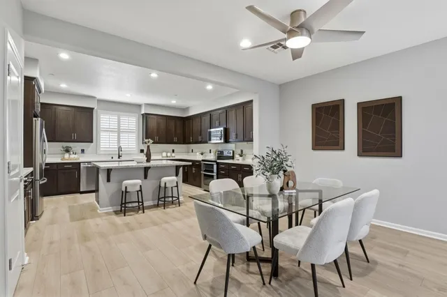 a living room with furniture potted plant and a window
