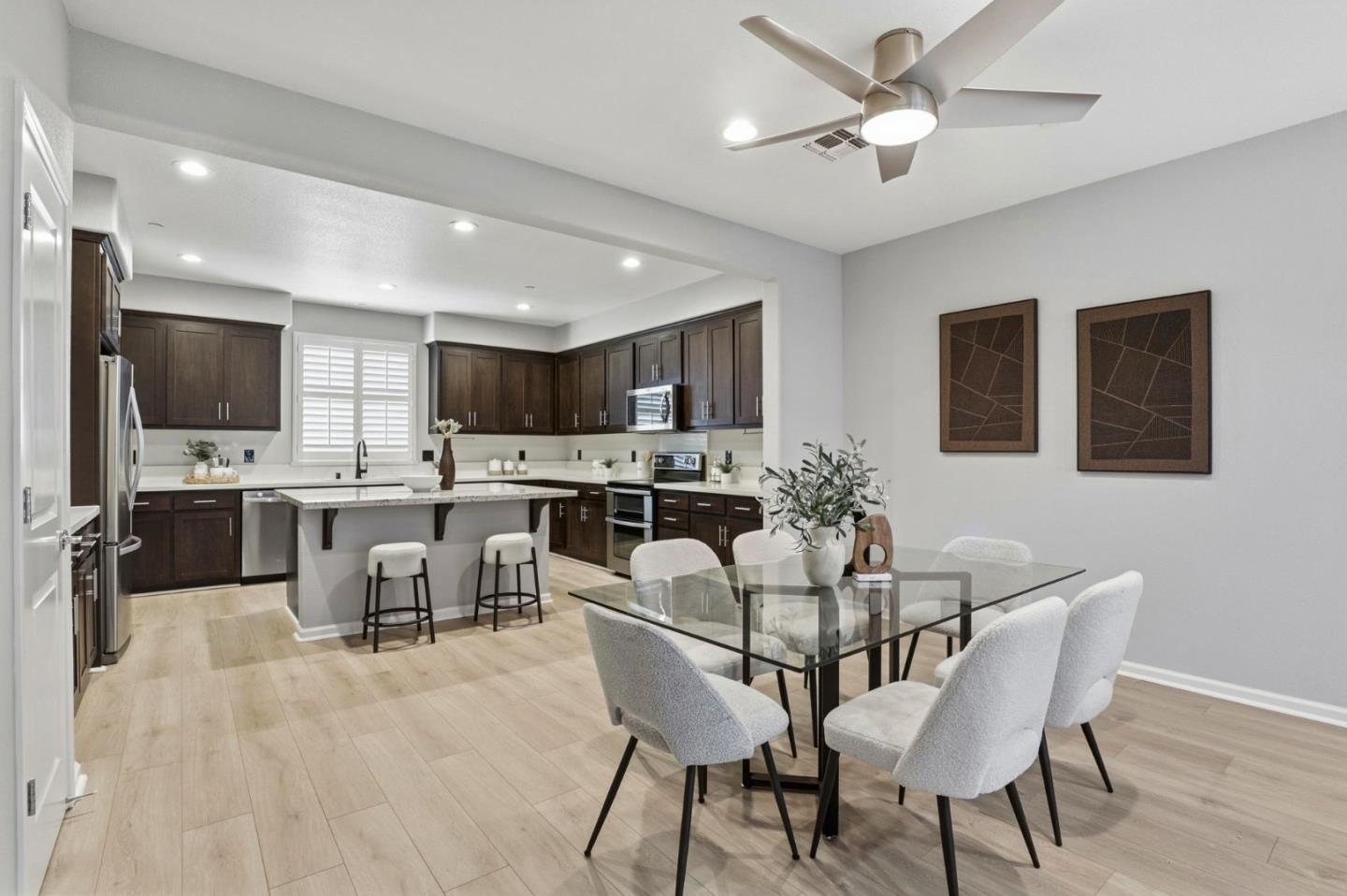 172 East Main Avenue Morgan Hill, CA 95037 - Photo 7 of 36 a view of a dining room with furniture and wooden floor