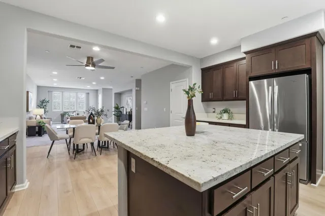 a view of kitchen with furniture and wooden floor