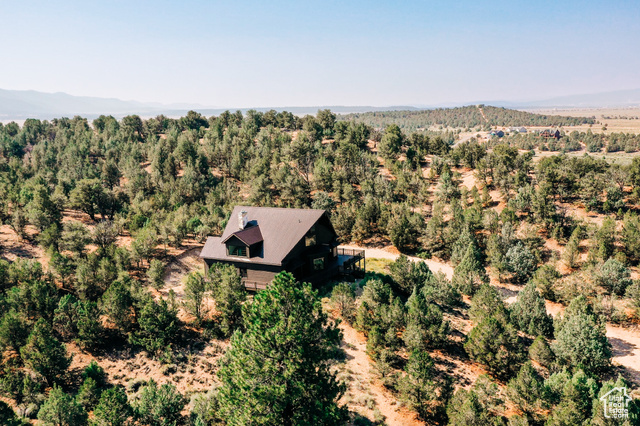 985 Russell Road Hatch, UT 84735 - Photo 27 of 30 View from above of property featuring mountains and a heavily wooded area