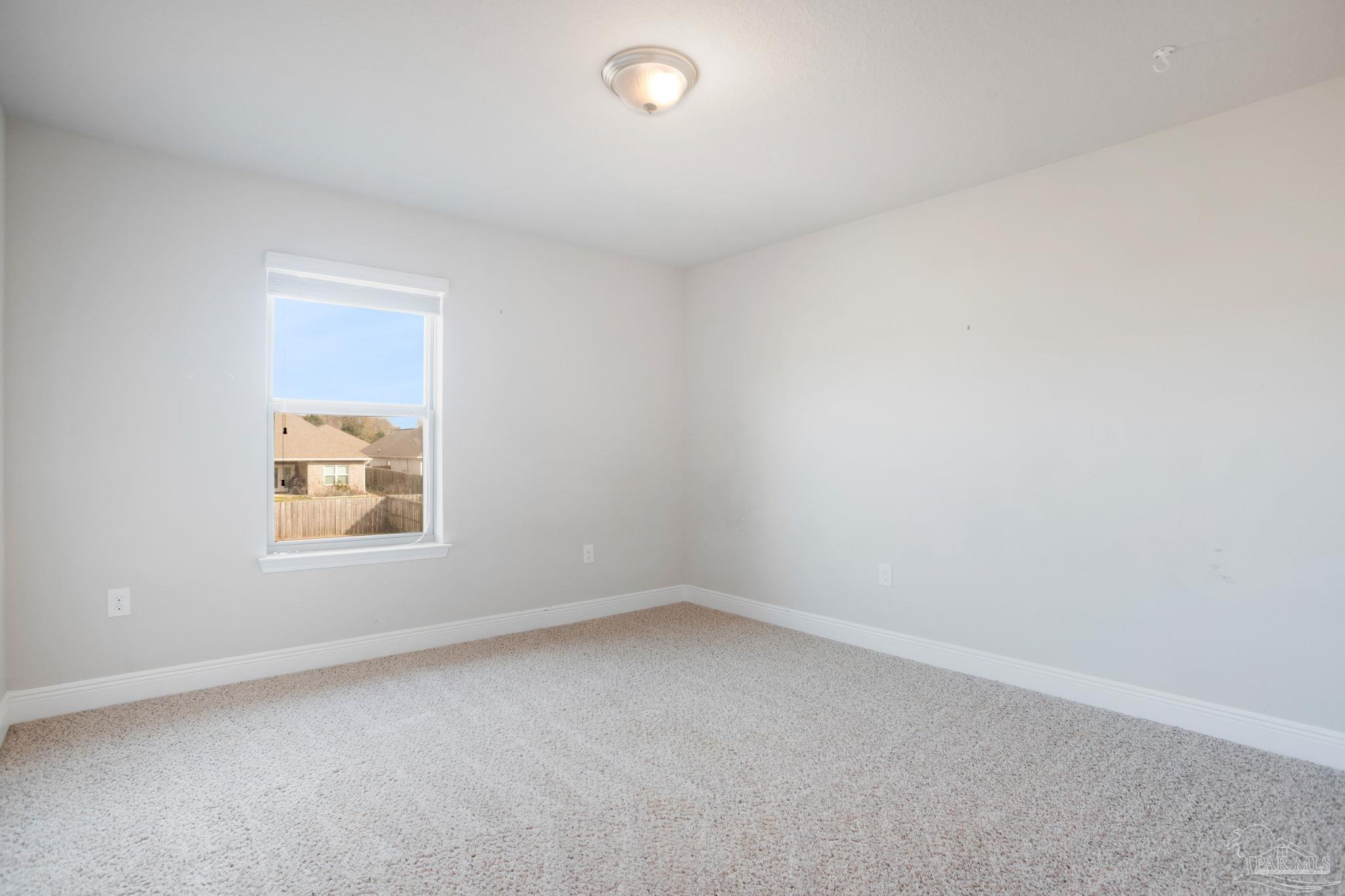 8016 Woodbrook Road Pensacola, FL 32526 - Photo 32 of 52 an empty room with a window