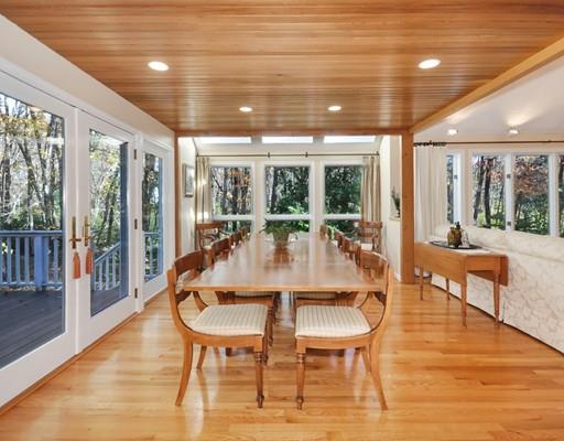 1115 North Road Carlisle, MA 01741 - Photo 5 of 30 a view of a dining room with furniture wooden floor and chandelier
