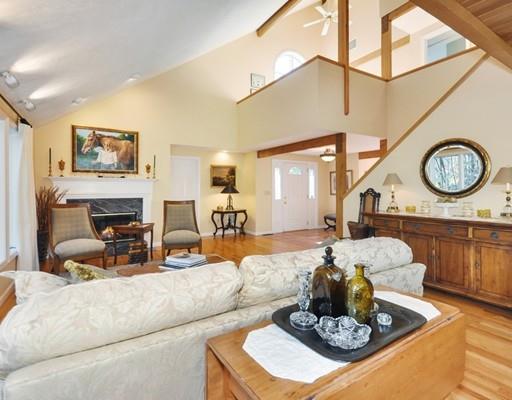 1115 North Road Carlisle, MA 01741 - Photo 6 of 30 a living room with furniture a fireplace and a table