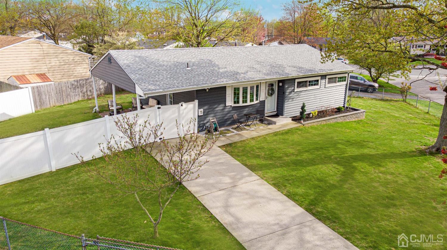 50 Harvard Road Old Bridge, NJ 08859 - Photo 40 of 44 a aerial view of a house with a yard table and chairs