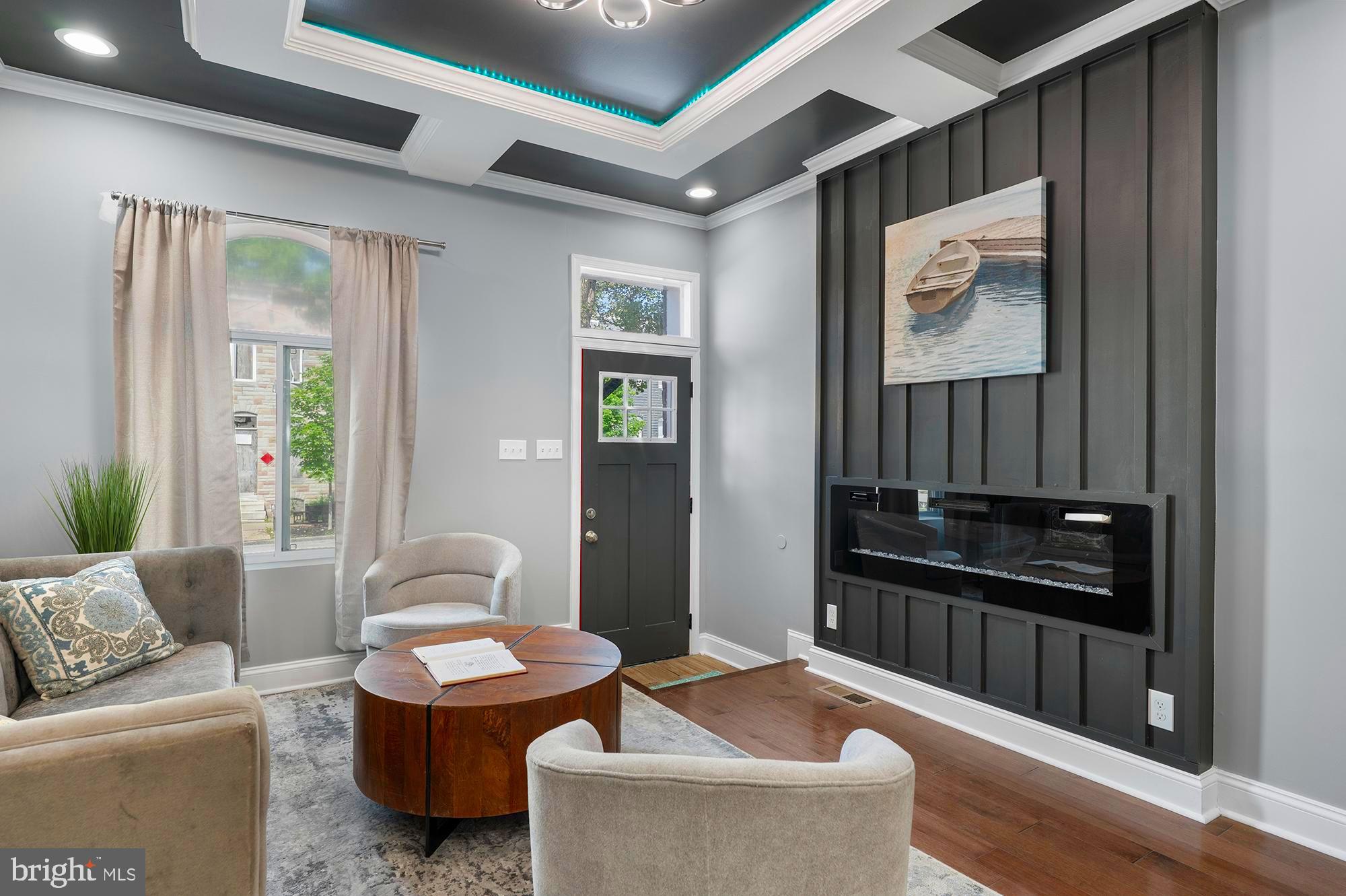 1513 North Wolfe Street Baltimore, MD 21213 - Photo 1 of 33 a living room with furniture and wooden floor