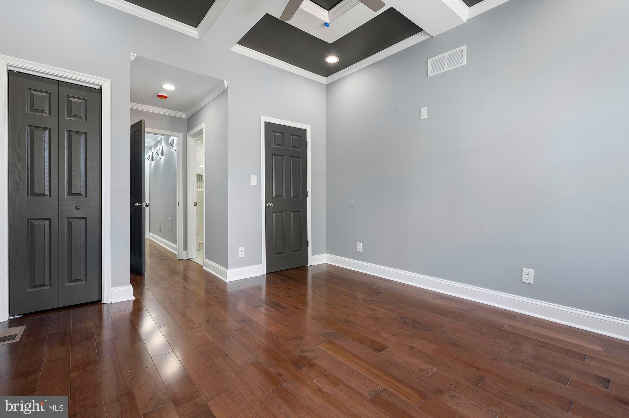 1513 North Wolfe Street Baltimore, MD 21213 - Photo 13 of 33 a view of an empty room with wooden floor