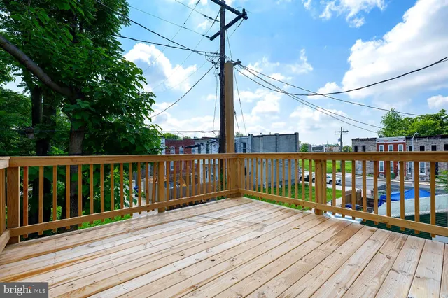 a view of balcony with wooden floor