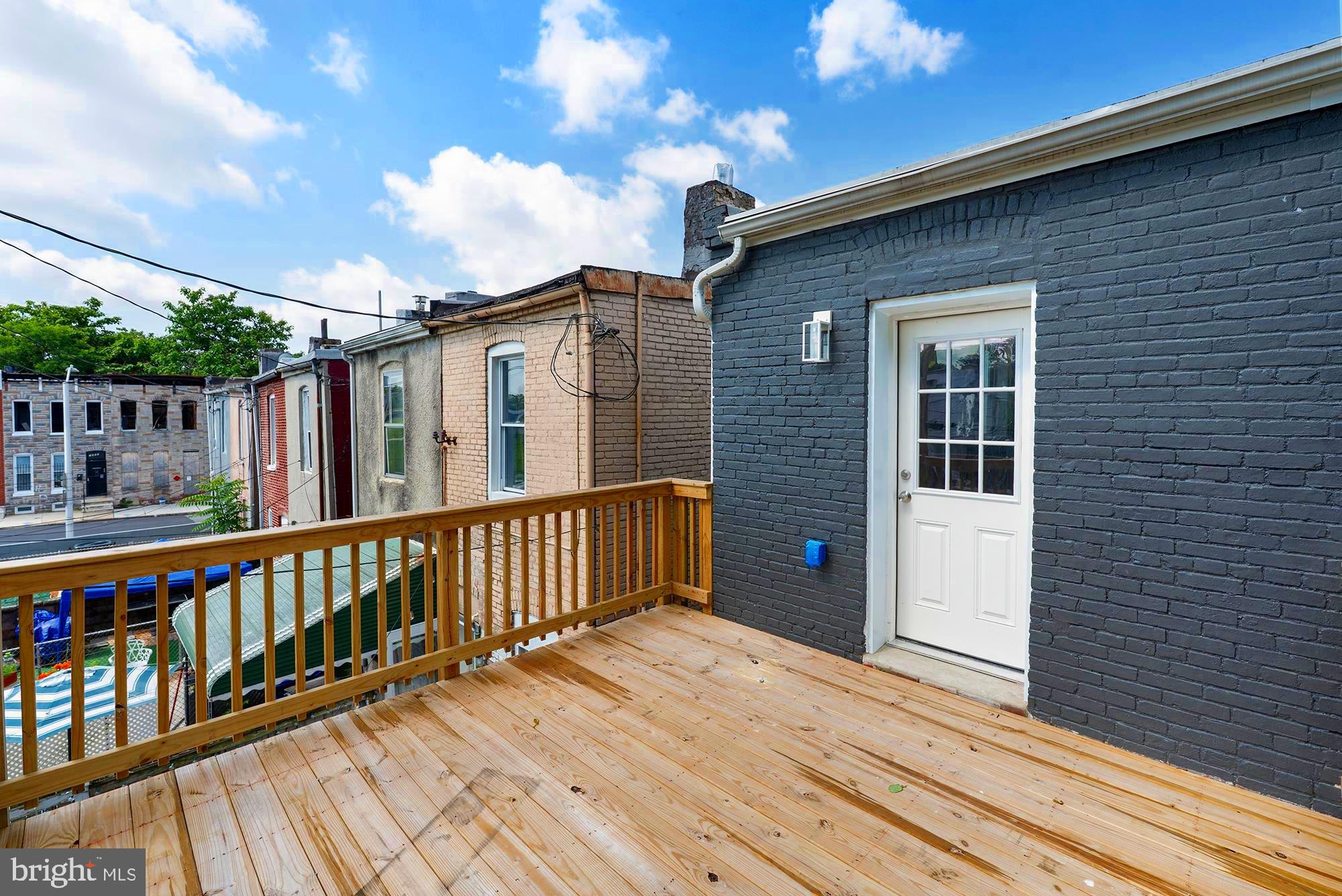 1513 North Wolfe Street Baltimore, MD 21213 - Photo 20 of 33 a view of a house with a balcony