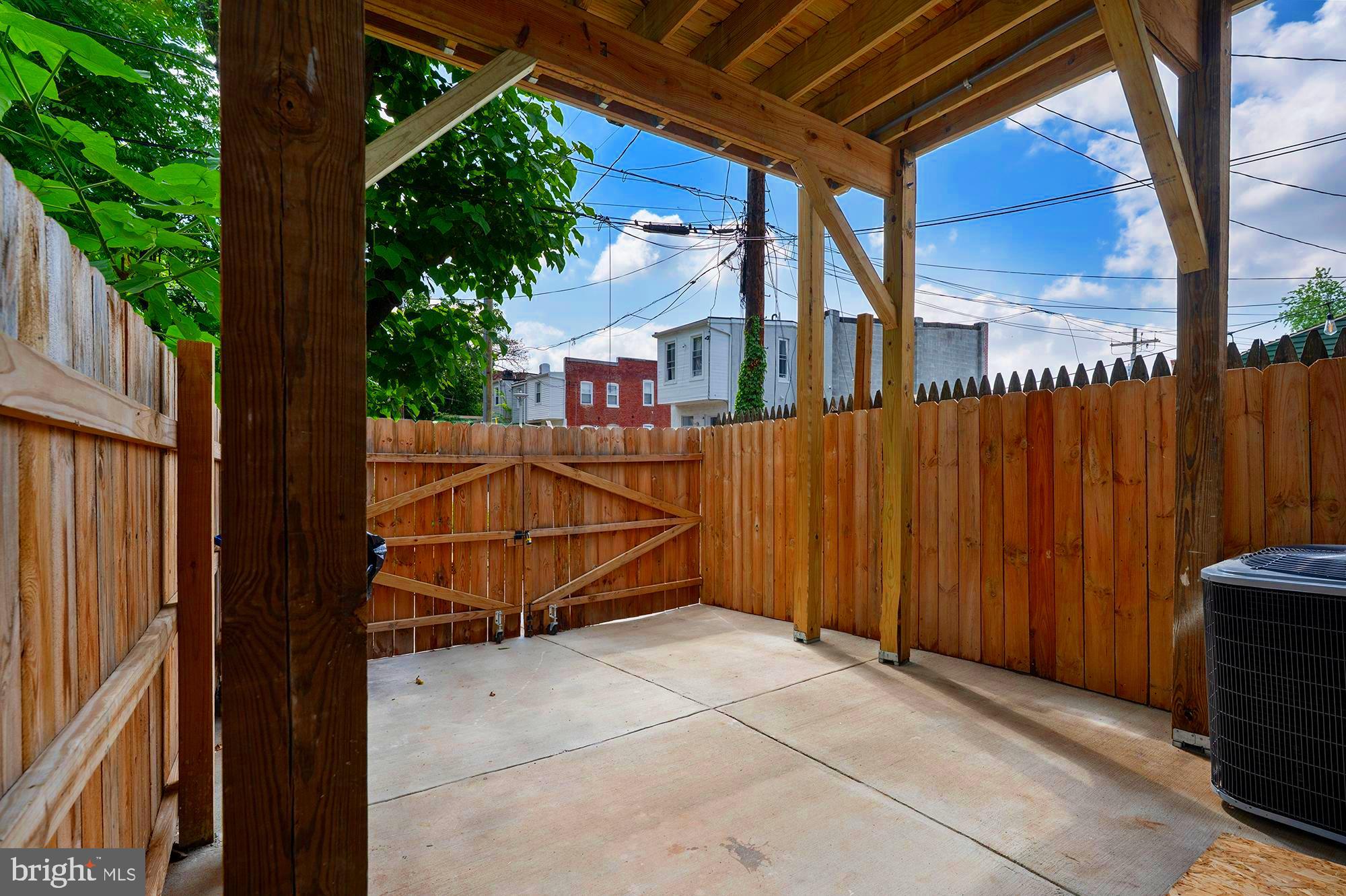 1513 North Wolfe Street Baltimore, MD 21213 - Photo 29 of 33 a view of a house with wooden fence