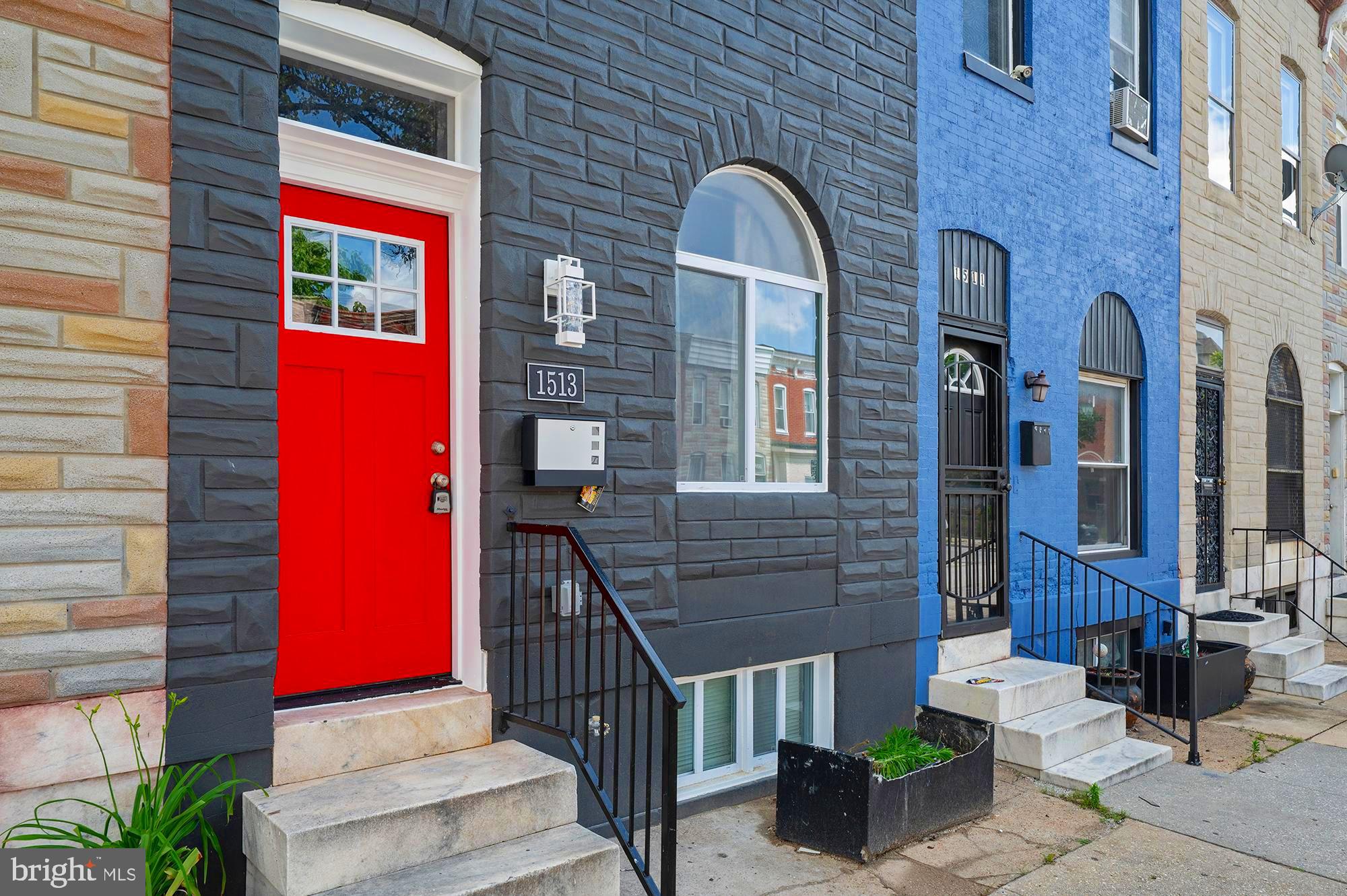 1513 North Wolfe Street Baltimore, MD 21213 - Photo 32 of 33 a front view of a house with large windows