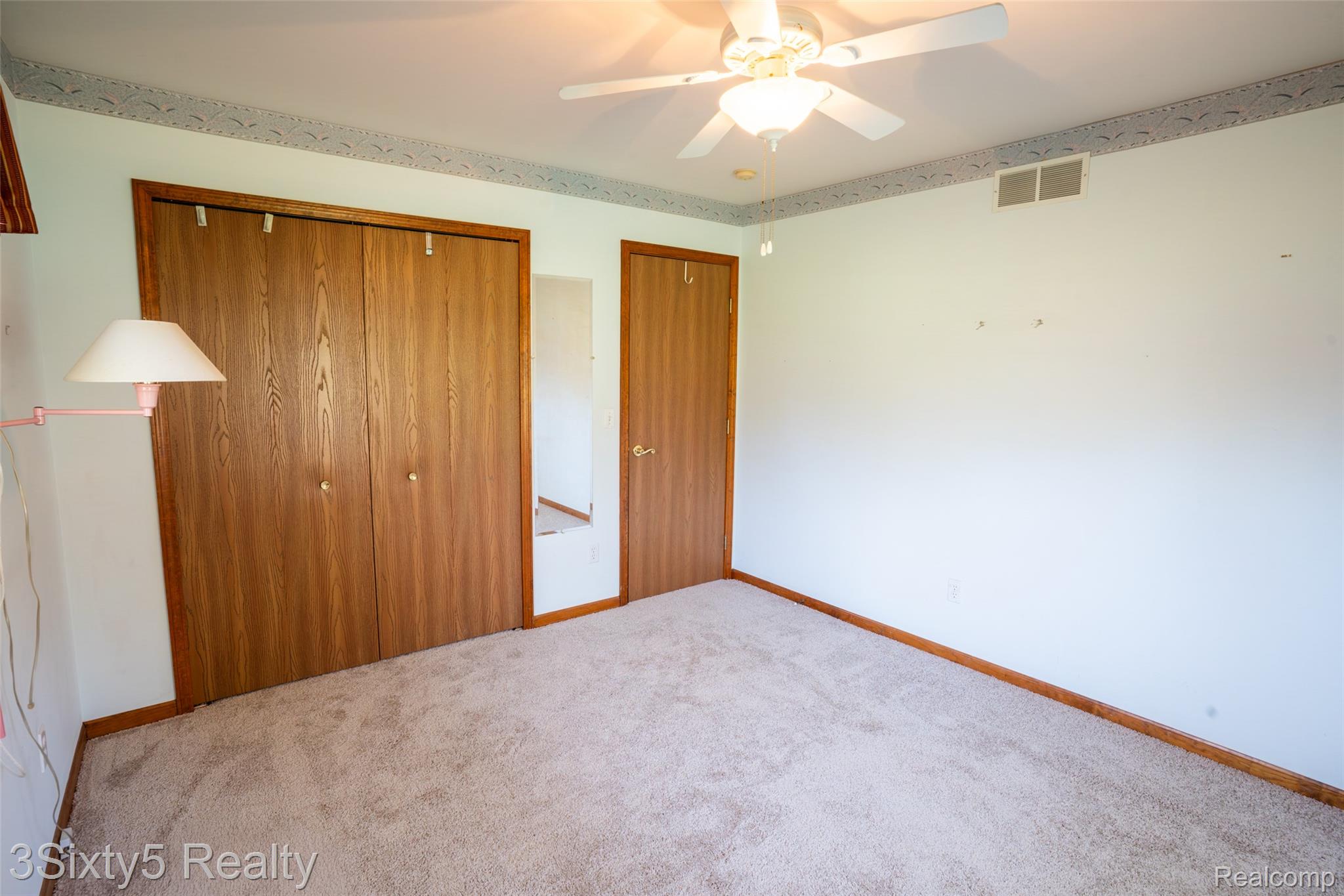 1783 Farnsworth Road Lapeer, MI 48446 - Photo 21 of 51 Unfurnished bedroom featuring a closet, carpet flooring, and a ceiling fan